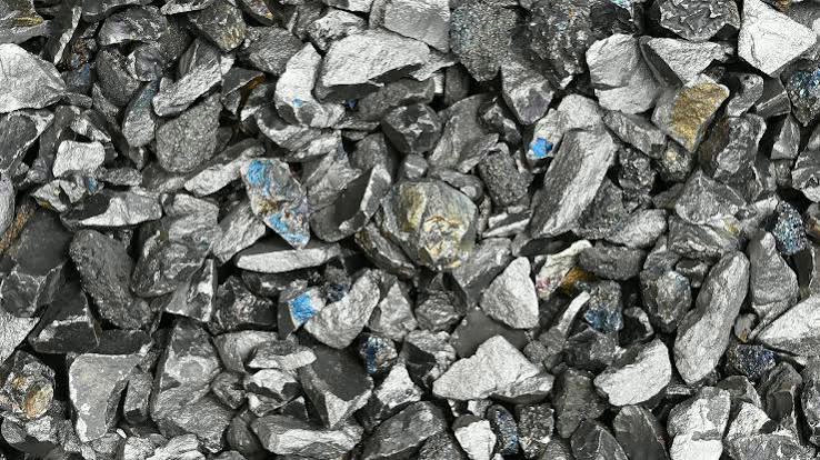 Manganese mining operation with excavator and haul truck